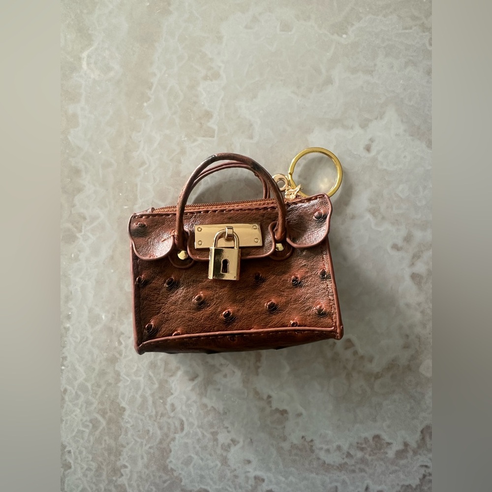 Mini faux ostrich leather keychain bag with gold hardware